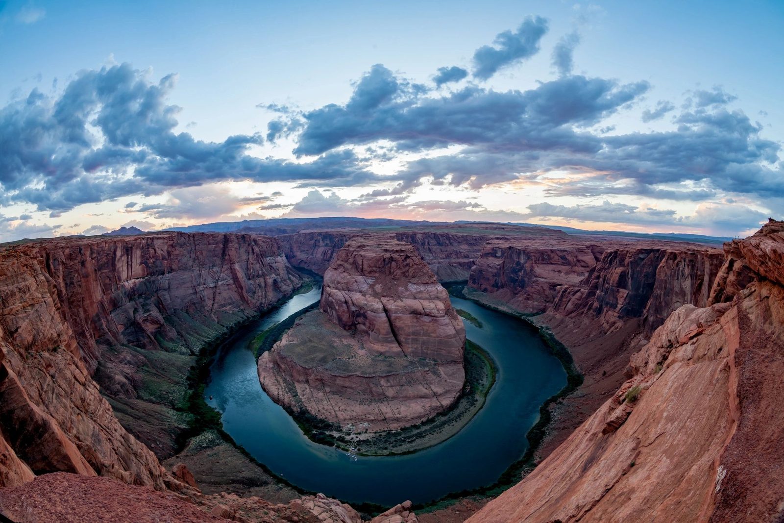 A group of travellers at a canyon overlook